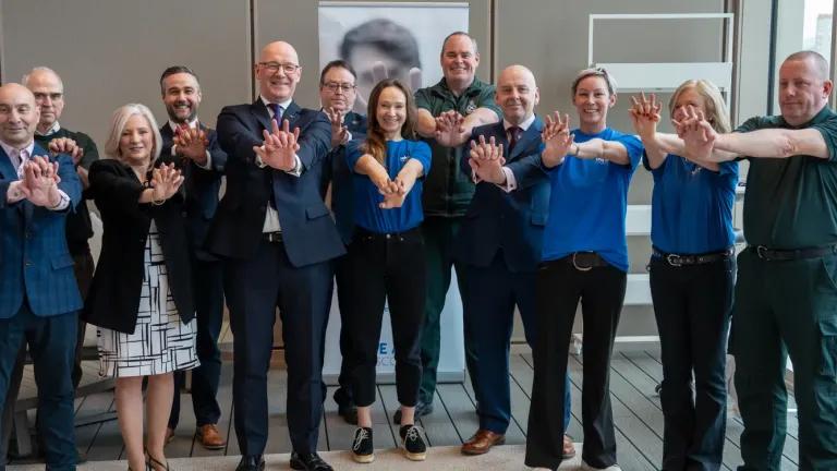 From left to right: Rodger Hill (David Hill Foundation), John Sinclair, Lesley Hill (David Hill Foundation), David McColgan (BHF Scotland), First Minister of Scotland John Swinney, David Argyle (University of Edinburgh), Dominika Skrocka (Save a Life for Scotland), Steven Short (Scottish Ambulance Service), Dr Gareth Clegg, Lisa MacInnes, Susan Gardner (all Save a Life for Scotland), David Bywater (Scottish Ambulance Service).