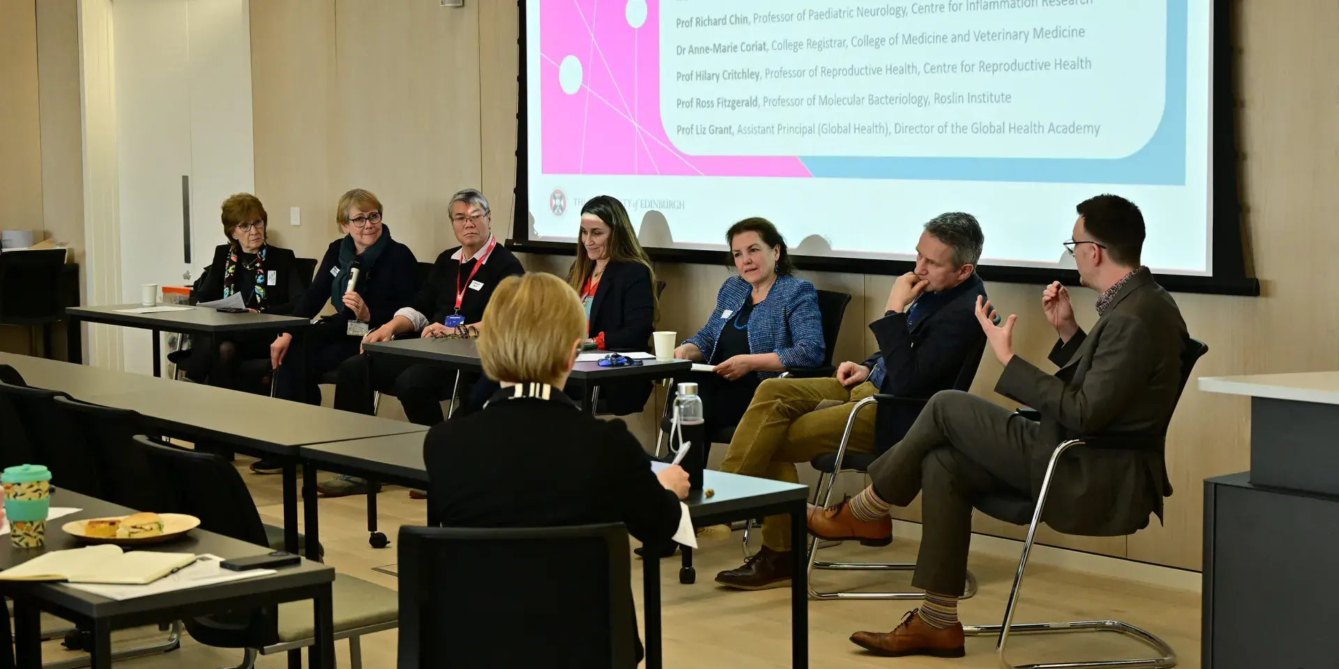 Martyn talks as the panel, seated, look to him and listen.