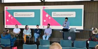 Lukas Engelmann introduces the panel, prompt on slide behind says 'How to articulate a critical perspective while working collaboratively with/within medical institutions.'