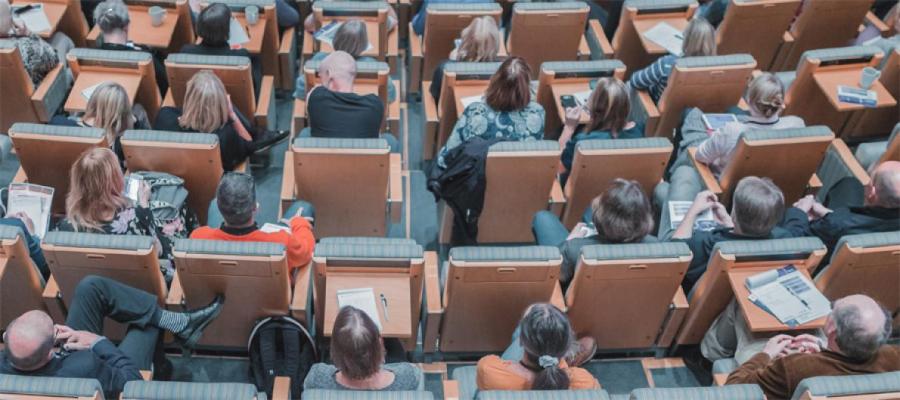 Delegates sitting in auditorium