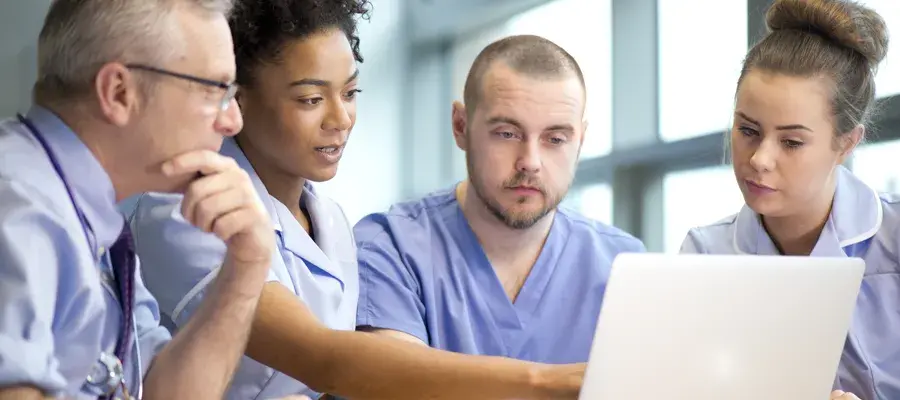 Care professionals working together on a single screen
