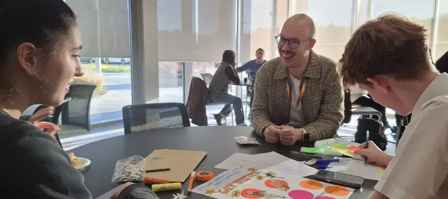 Photograph of Jaime Garcia Iglesias leading a HIV and Stigma workshop with high school students 