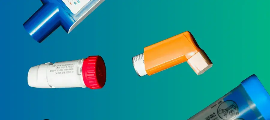 Blue green background, photograph of various inhalers