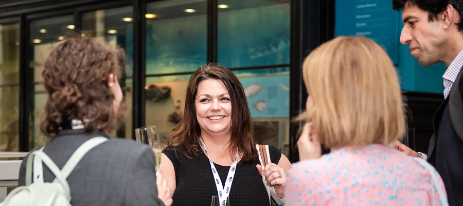 Four people networking at an event