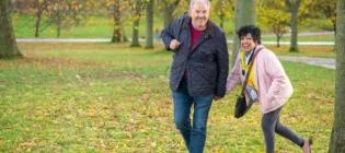 Couple laughing outside