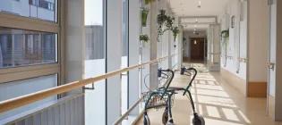 lone zimmerframe in hospital corridor