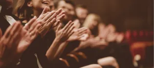 Usher News clapping hands