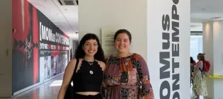 Two PhD Students at a conference