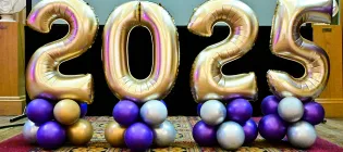Gold balloons in the shape of 2025