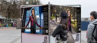 People viewing an outdoor exhibit