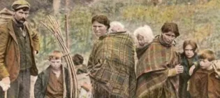 George McPhee and family with sticks for a bow tent, Scotland, c 1910