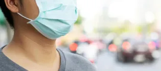 Person wearing face mask in public setting