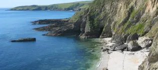 Beach below high cliff Maenporth