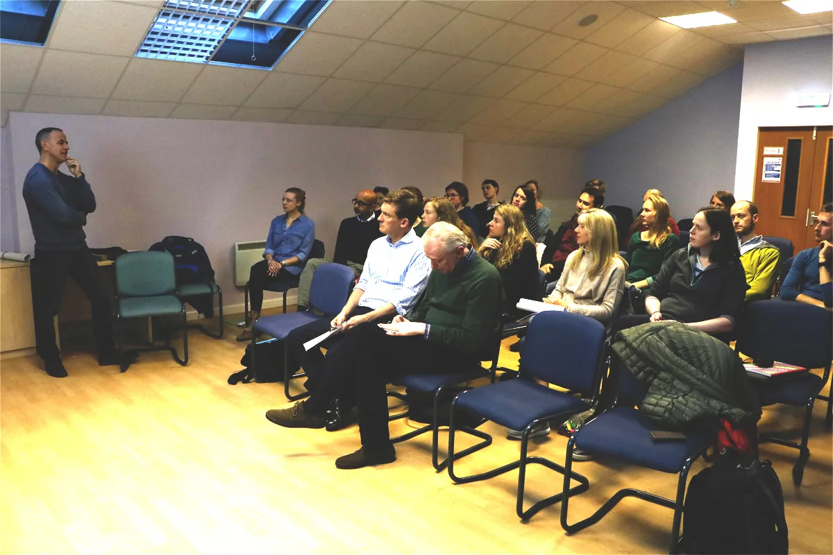 Group members listening to speaker