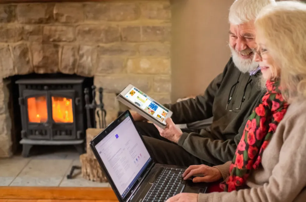 Couple in Later life on Laptops