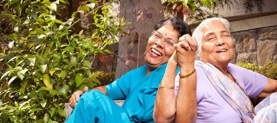 Elderly mother and daughter wearing saris