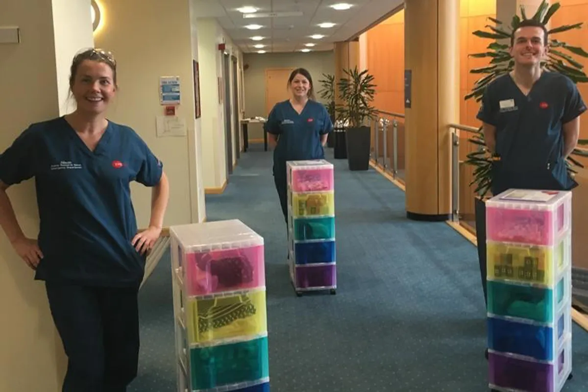 staff pose with Rainbow boxes