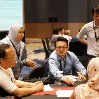 People having a discussion around a table