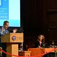 Photograph of Dr David B. Nash presenting at the the Usher Institute Annual Lecture and Showcase 2025