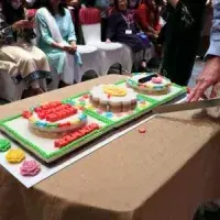 Three colourful cakes on a table