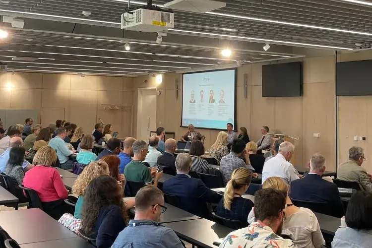 Photograph of audience and presenters during the Usher Connects | Sudlow Review event