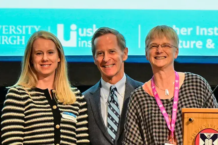 Photograph of poster prize winner, Susanne Maxwell, at the Usher Institute Annual Lecture & Showcase 2025 with David Nash and Cathie Sudlow