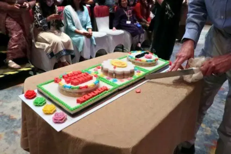 Three colourful cakes on a table