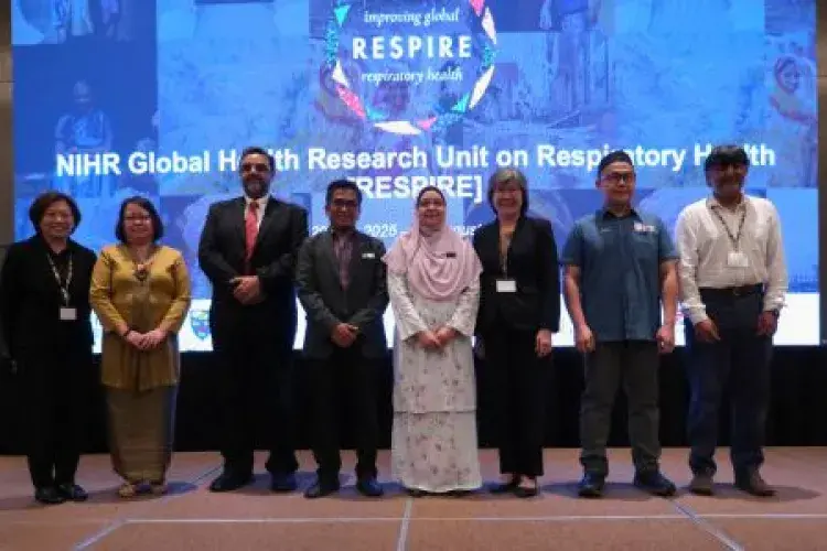 Eight people standing on a stage