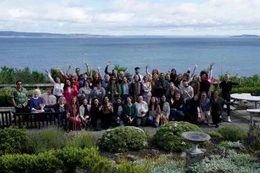A photograph of the attendees in front of the Firth of Forth