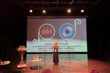 Noa Kurumi Nishizaw presenting her work at the conference