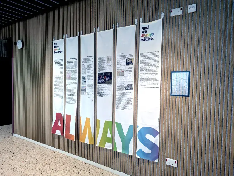 Photograph showing the student exhibition entitled "We have always been here. And we always will be."