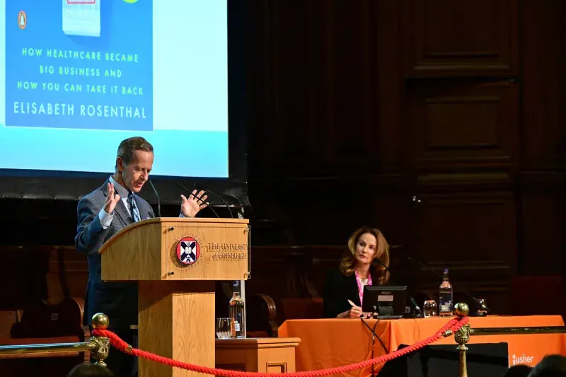 Photograph of Dr David B. Nash presenting at the the Usher Institute Annual Lecture and Showcase 2025