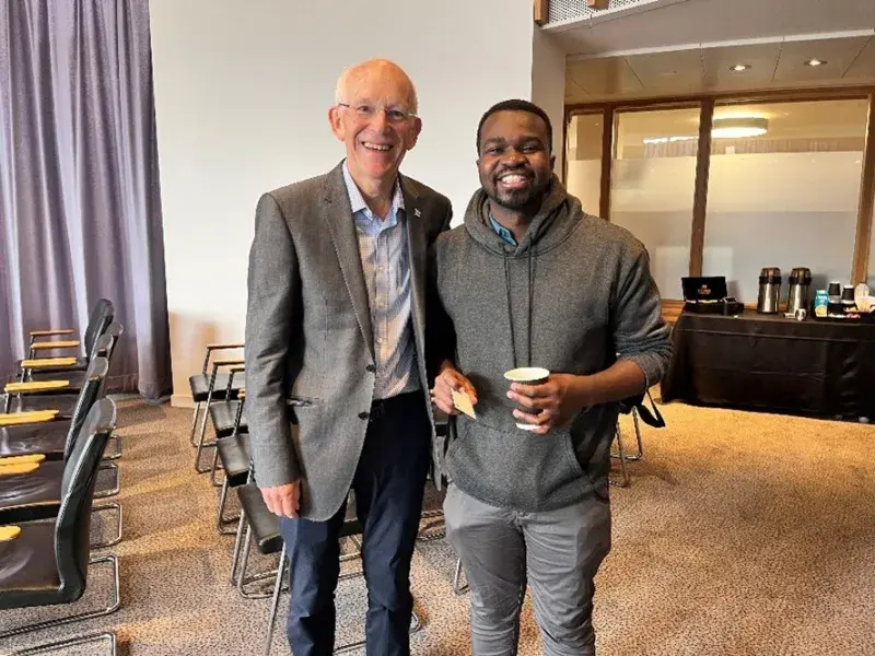 Photograph of Professor Scott Murry and Master of Family Medicine student, Ian Kibet, at 2025 Summer School 