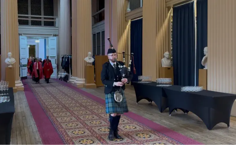 PhD student and championship bagpipe player, Lachlan Dick, leading the professorial procession to the 2025 Usher Institute inaugural lectures