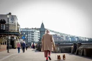 man walking on quayside