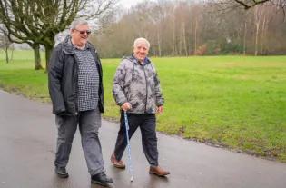 older adults walking in park