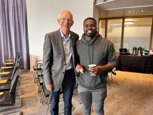 Photograph of Professor Scott Murry and Master of Family Medicine student, Ian Kibet, at 2025 Summer School 