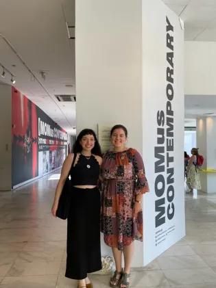 Two PhD Students at a conference