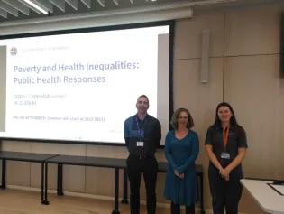 three presenters at a conference