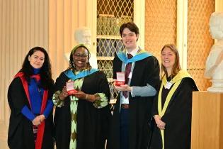 2025 John Last Award joint winners, Yvonne Kinyanjui and Shane McCarthy, standing inbetween Evgeniya Plotnikova and Nynke Halbesma