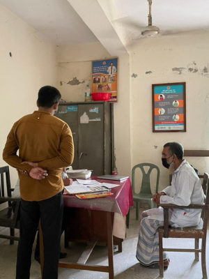 A patient and caregiver await an appointment