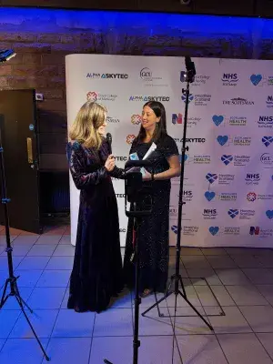 Photograph of Claire Yerramasu being interviewed after winning the Allied Health Professional Award at the 2025 Scotland's Health Awards event
