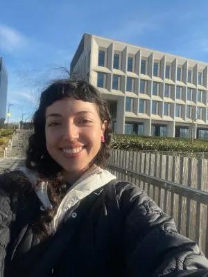 Deniz Hepdogan in front of the Usher Building