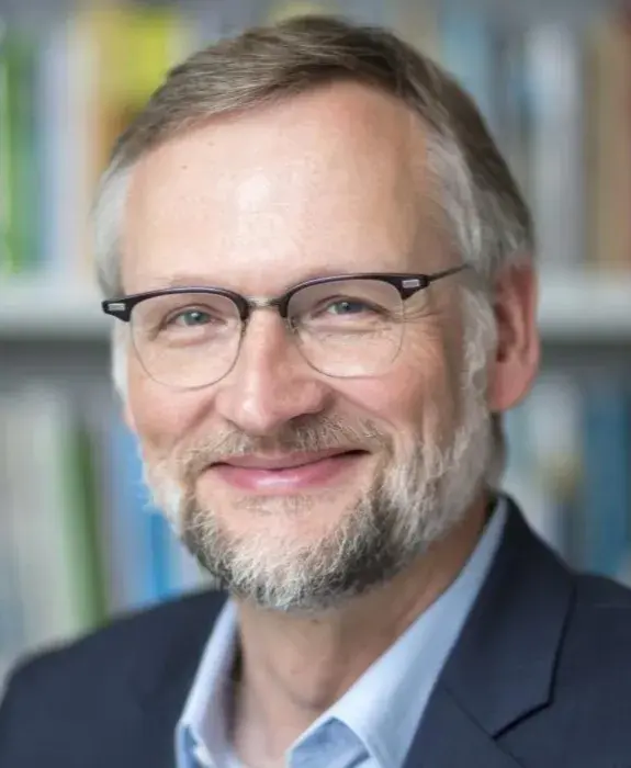 A promotional poster for an event titled “Building Capability in Behavioural Research.” The event takes place on June 30th, 2026, at the Teaching and Learning Building, University of Birmingham. On the right side, there is a professional portrait of Professor Ralph Hertwig, wearing a blue blazer and sitting in front of a bookshelf. Above the image are the logos for Behavioural Research UK and Centre–UB.