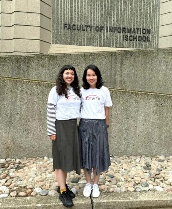 Deniz and Szu-Chia stand outside the Faculty of Information