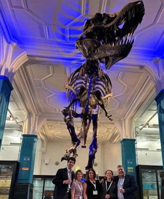 EPIC team stood under a dinsaur skeleton