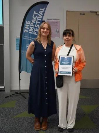 Rachel Thomsen and Joanne receive the Research Engagement Newcomer Prize
