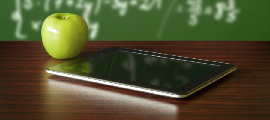 Apple and tablet computer on a table