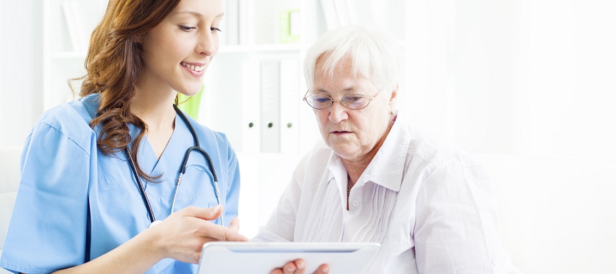 A nurse talking with a patient