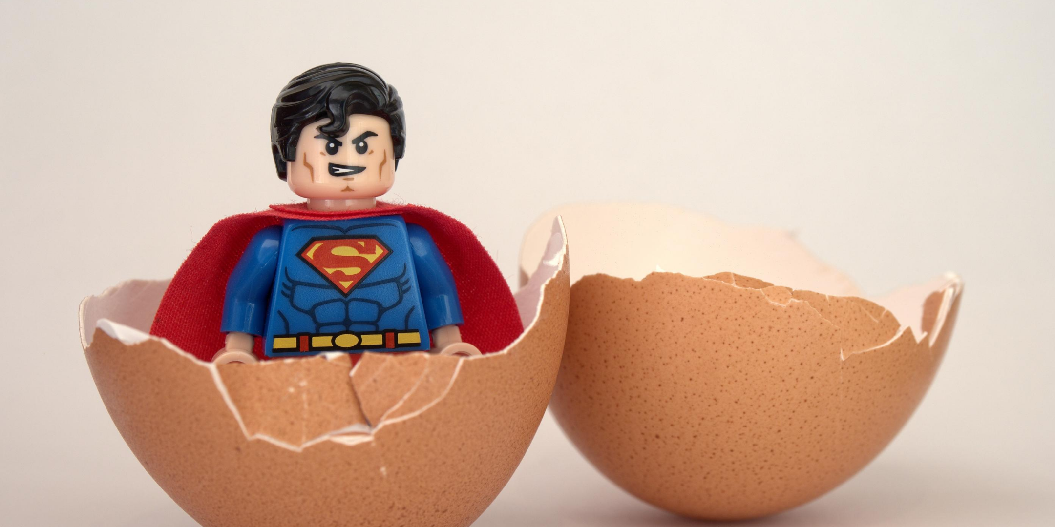 image of superman coming out of an egg